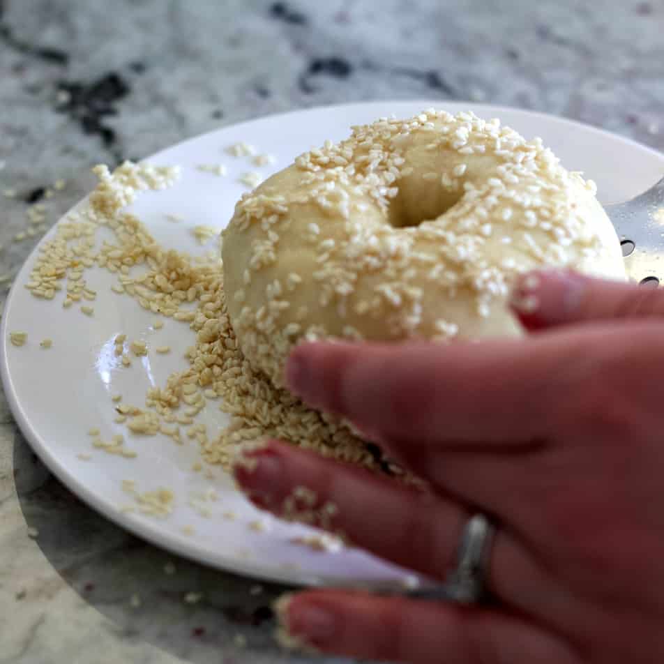 topping bagels with sesame