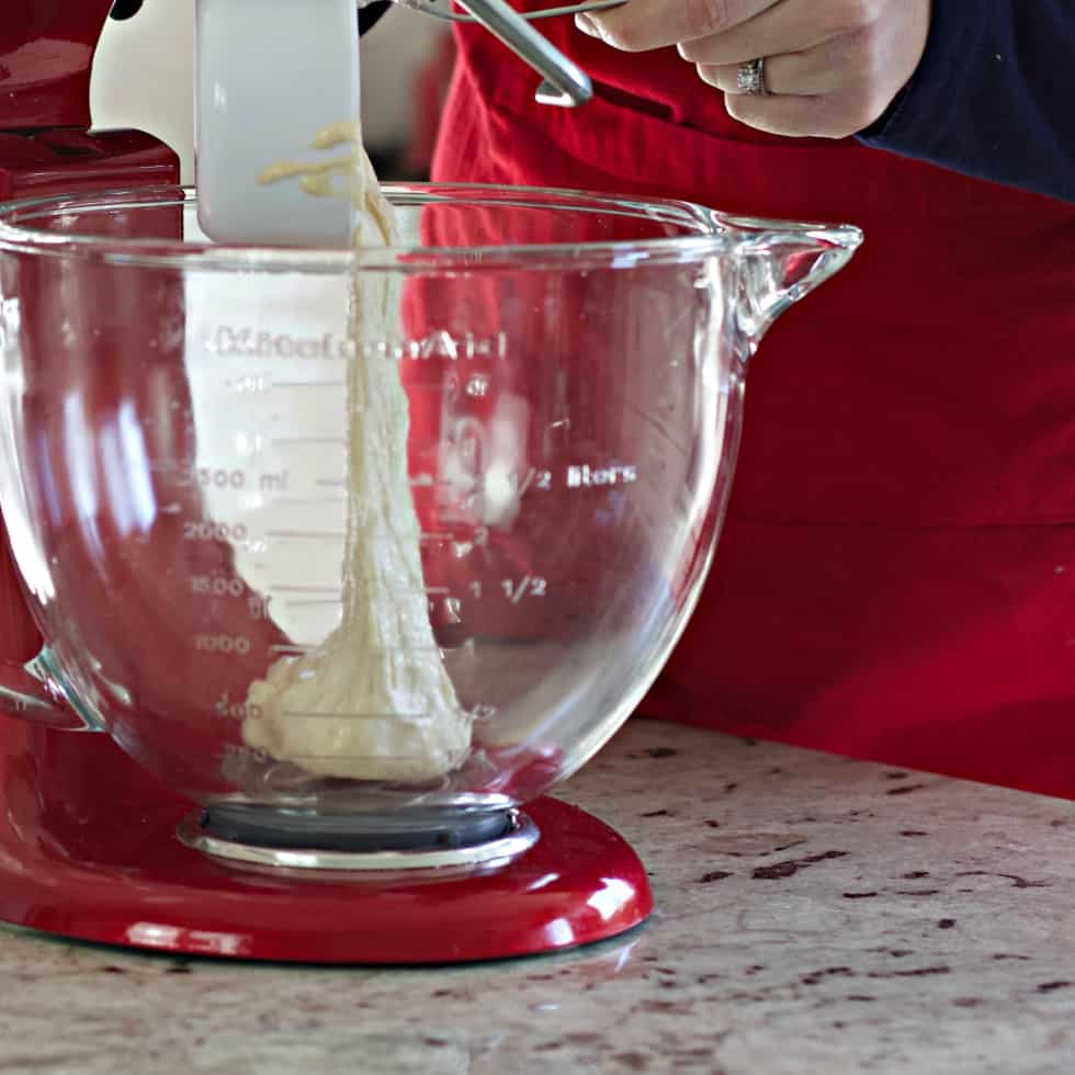 Adding starter to mixing bowl