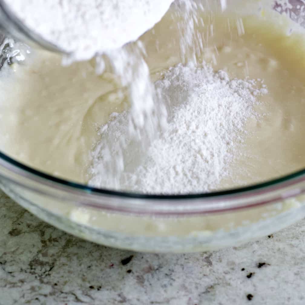 Pouring dry ingredients into wet. muffin recipe