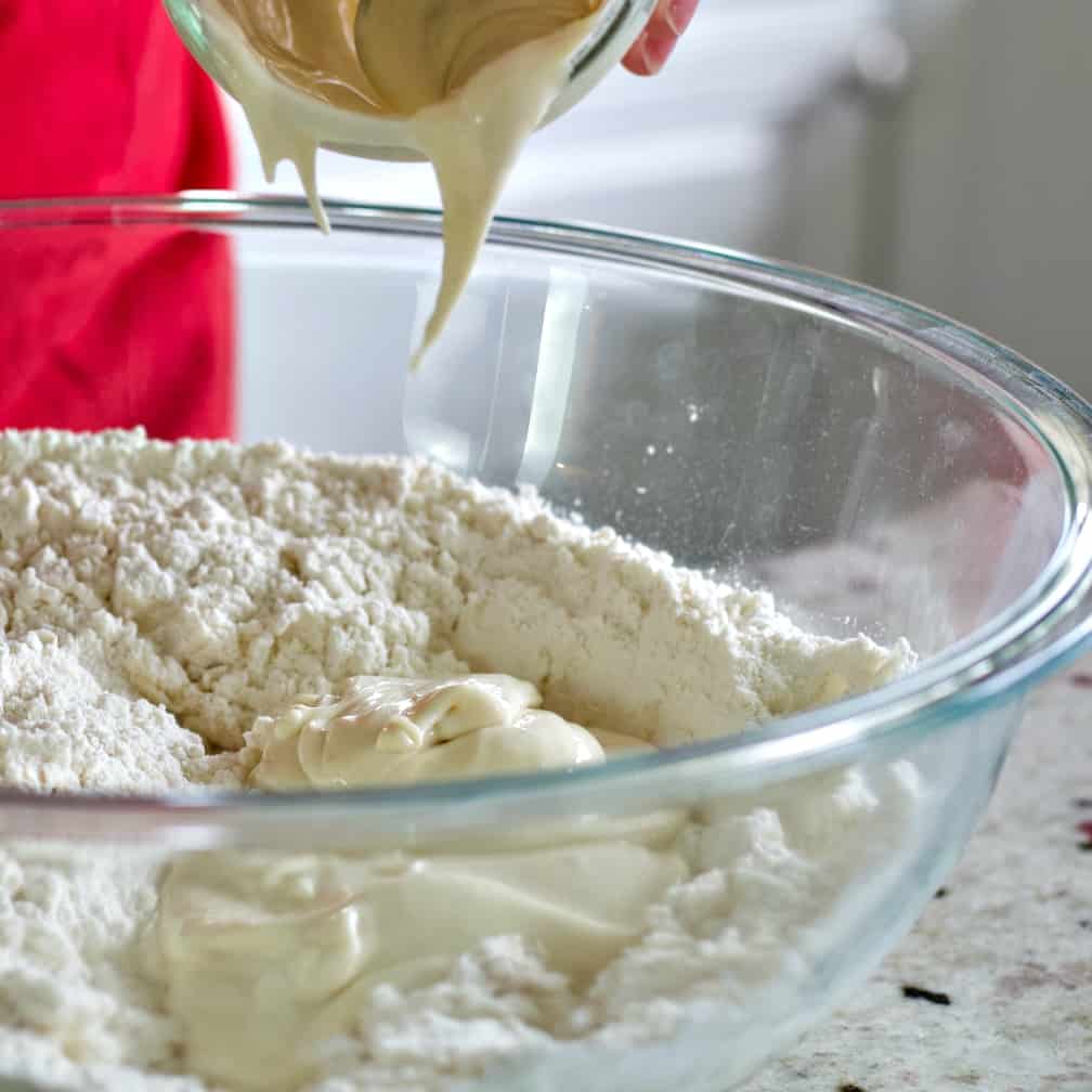 Pouring starter into bowl-pretzels