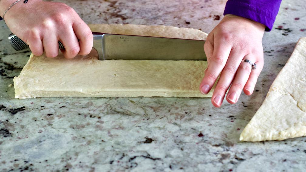cutting sourdough pretzel dough