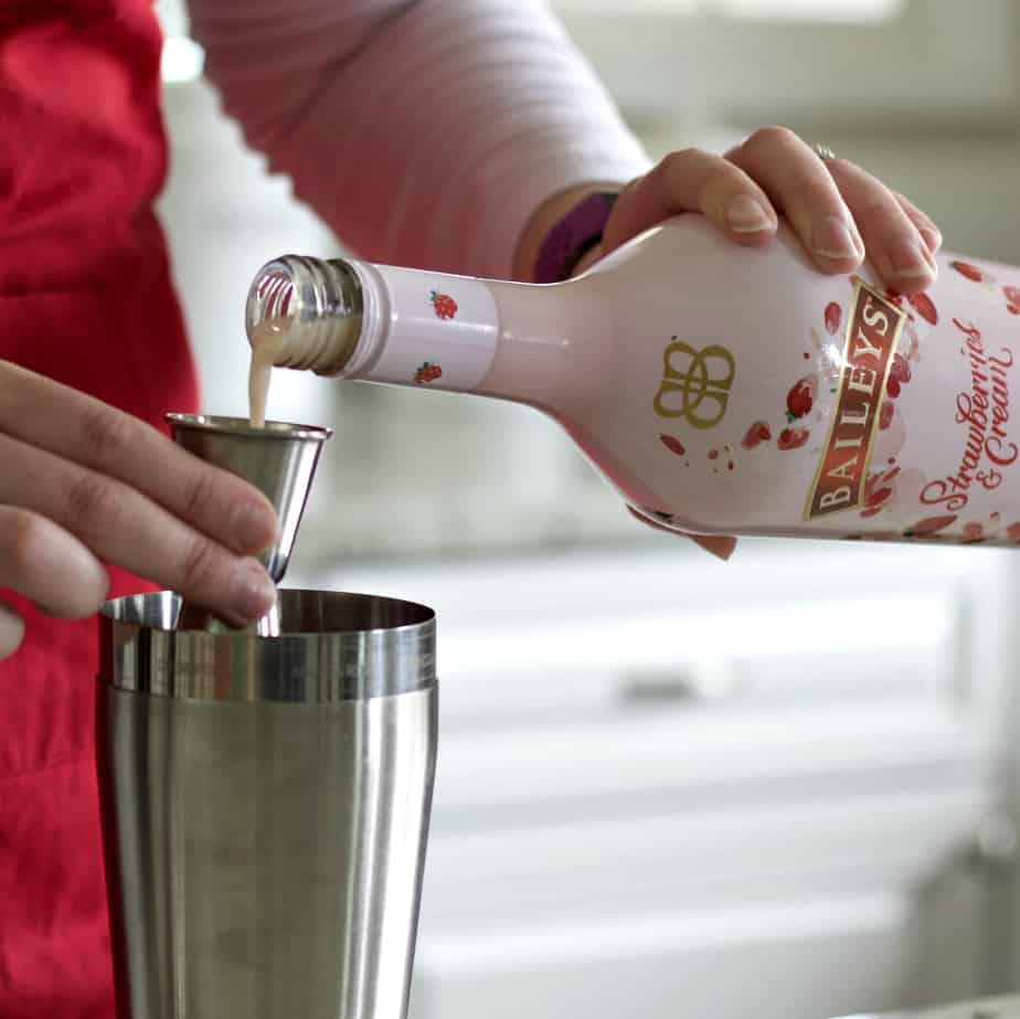 measuring Baileys Strawberries and cream liqueur