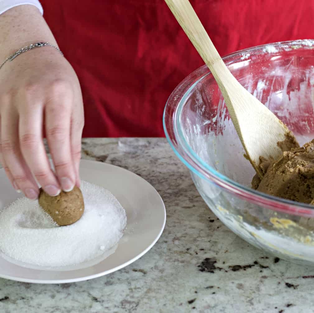 roll molasses cookies in sugar