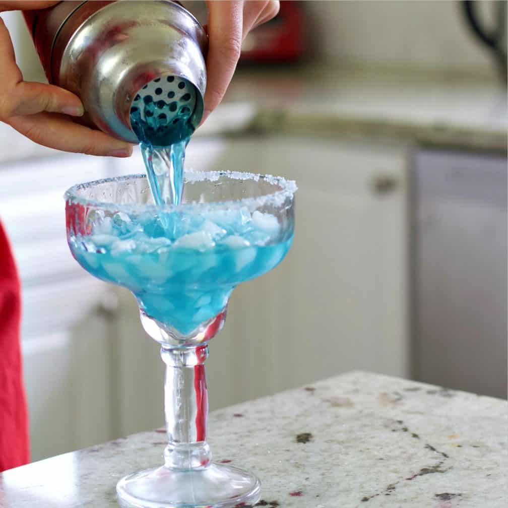 Straining the blue margarita