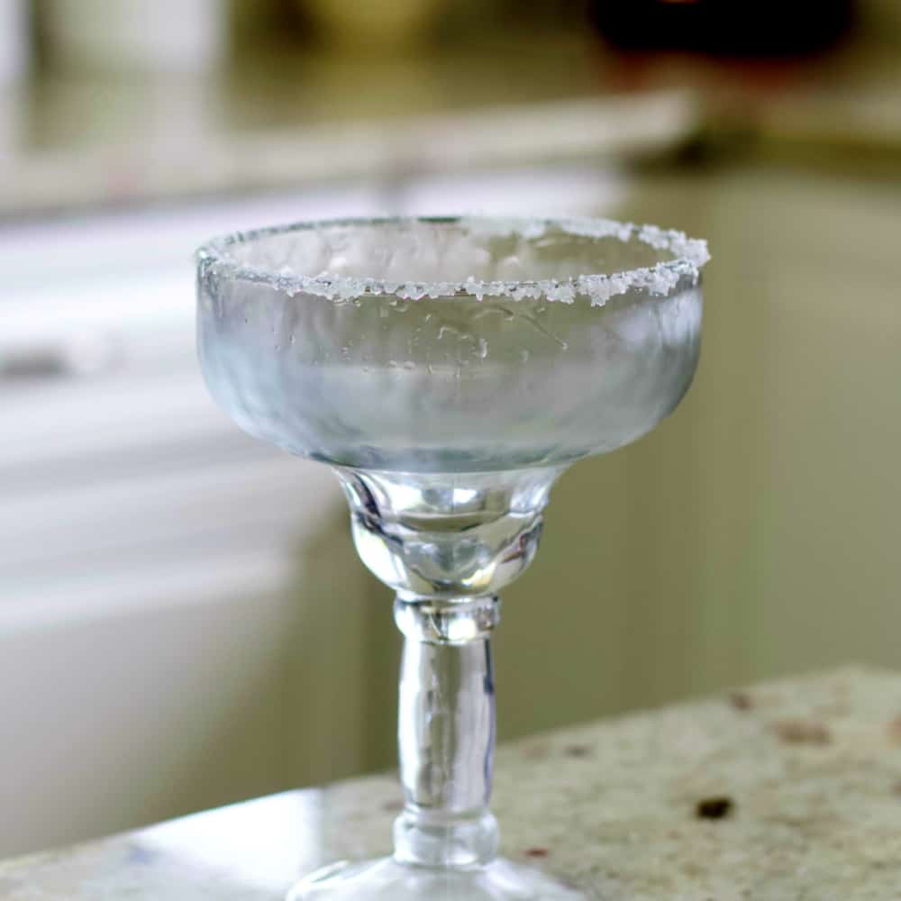 Salt rimmed Margarita glass for blue margarita.