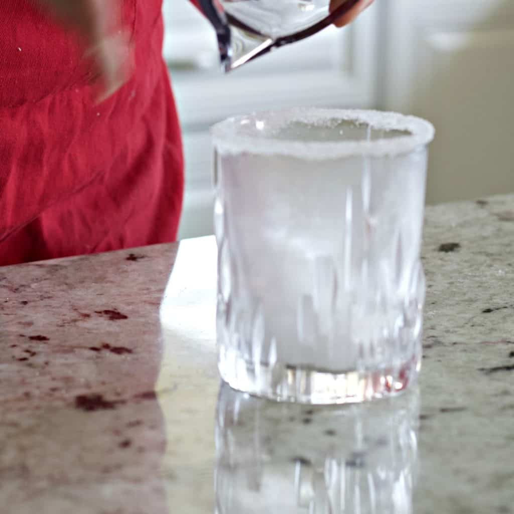 filling glass with ice.