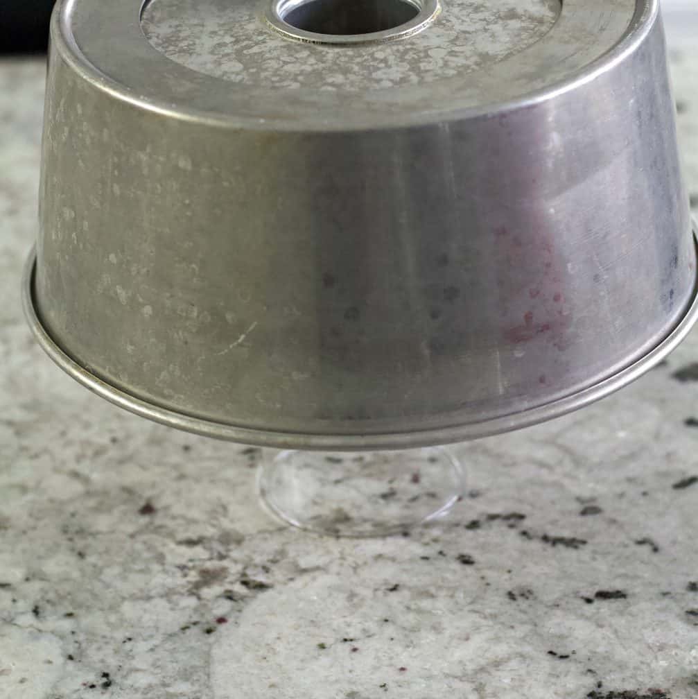 invert the baked angel food cake to cool