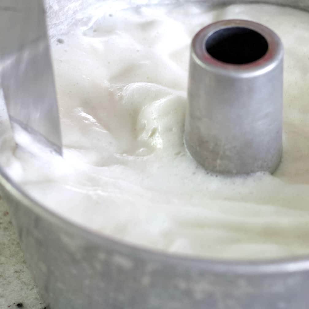 cutting through angel cake batter.