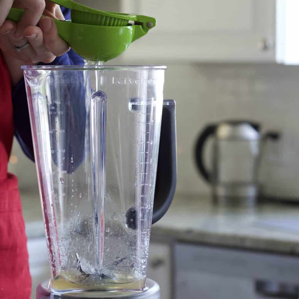 squeezing a lime into a blender