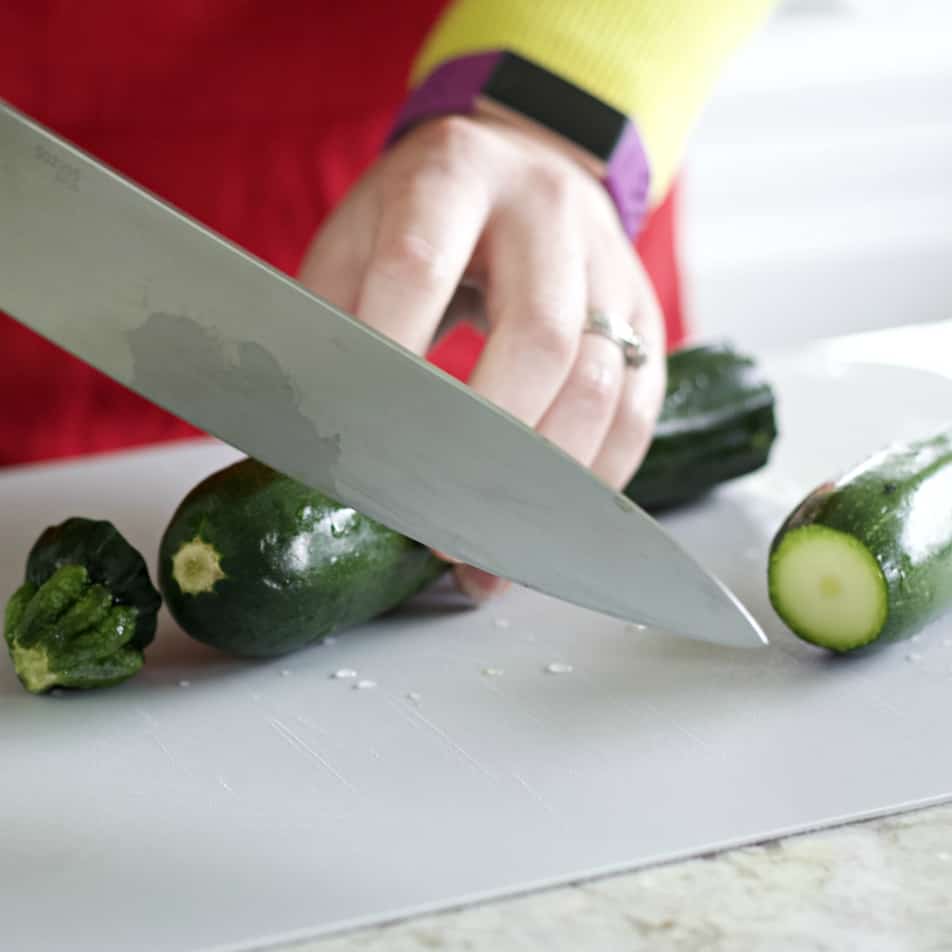 chopping ends off zucchini