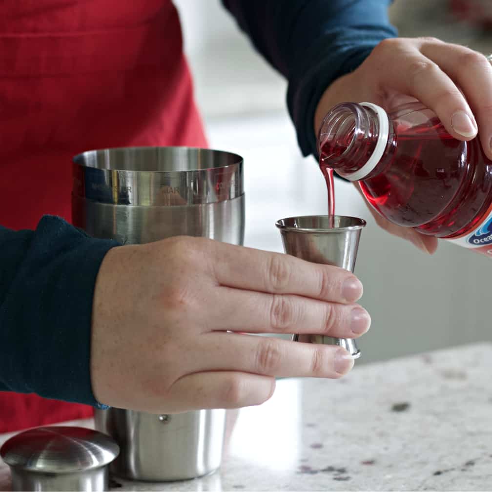measuring cranberry juice.
