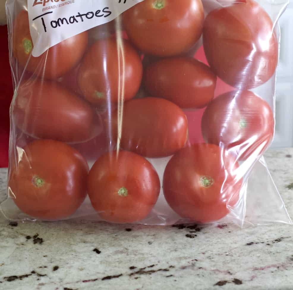 tomatoes in a labeled freezer bag.