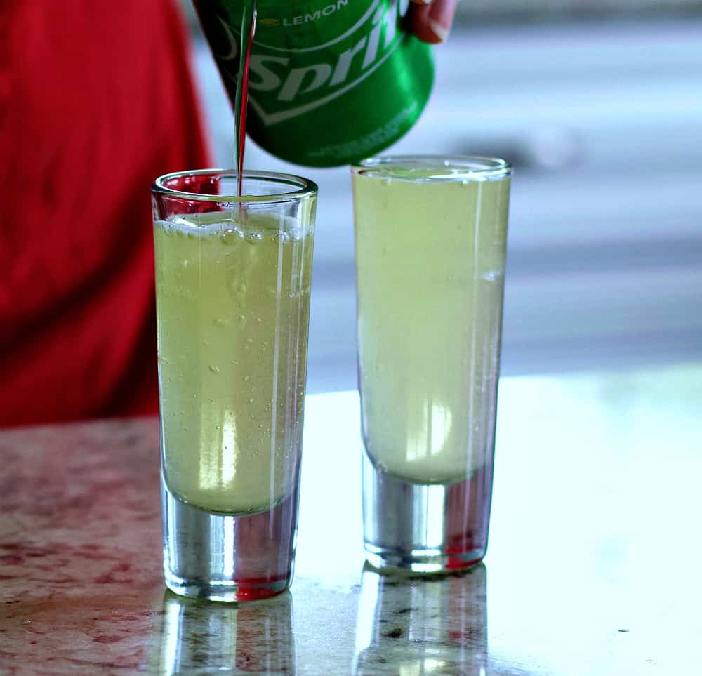 topping the green tea shot with sprite