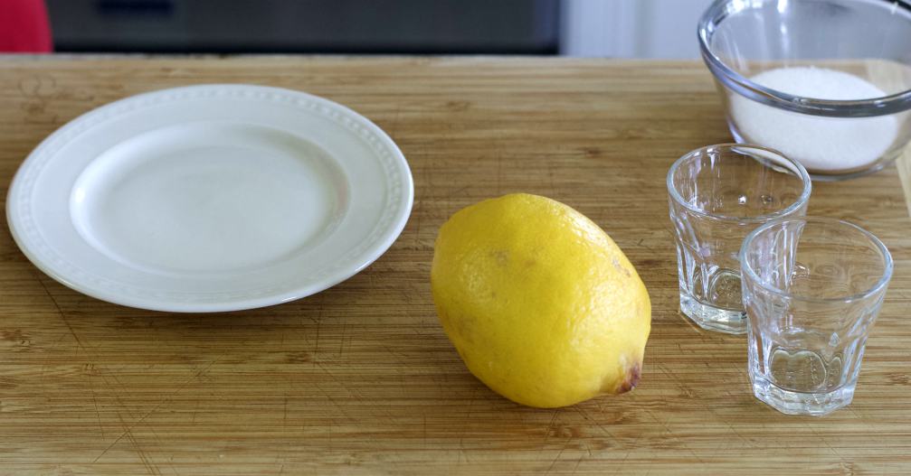 how to rim a shot glass. plate, syrup shot glass and lemon