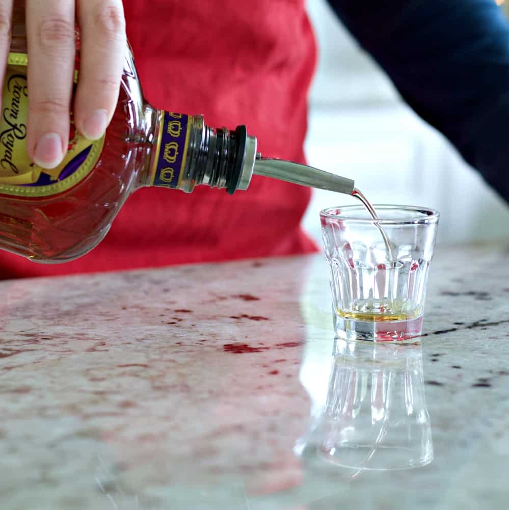 pouring crown royal whiskey