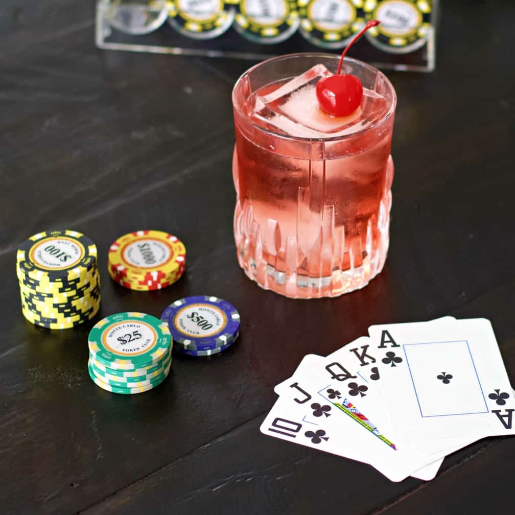 royal flush drink with poker chips and cards.