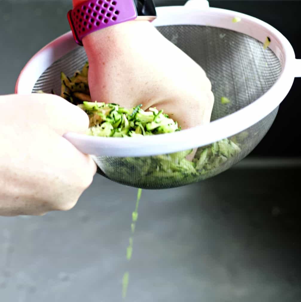 squeezing juices out of zucchini