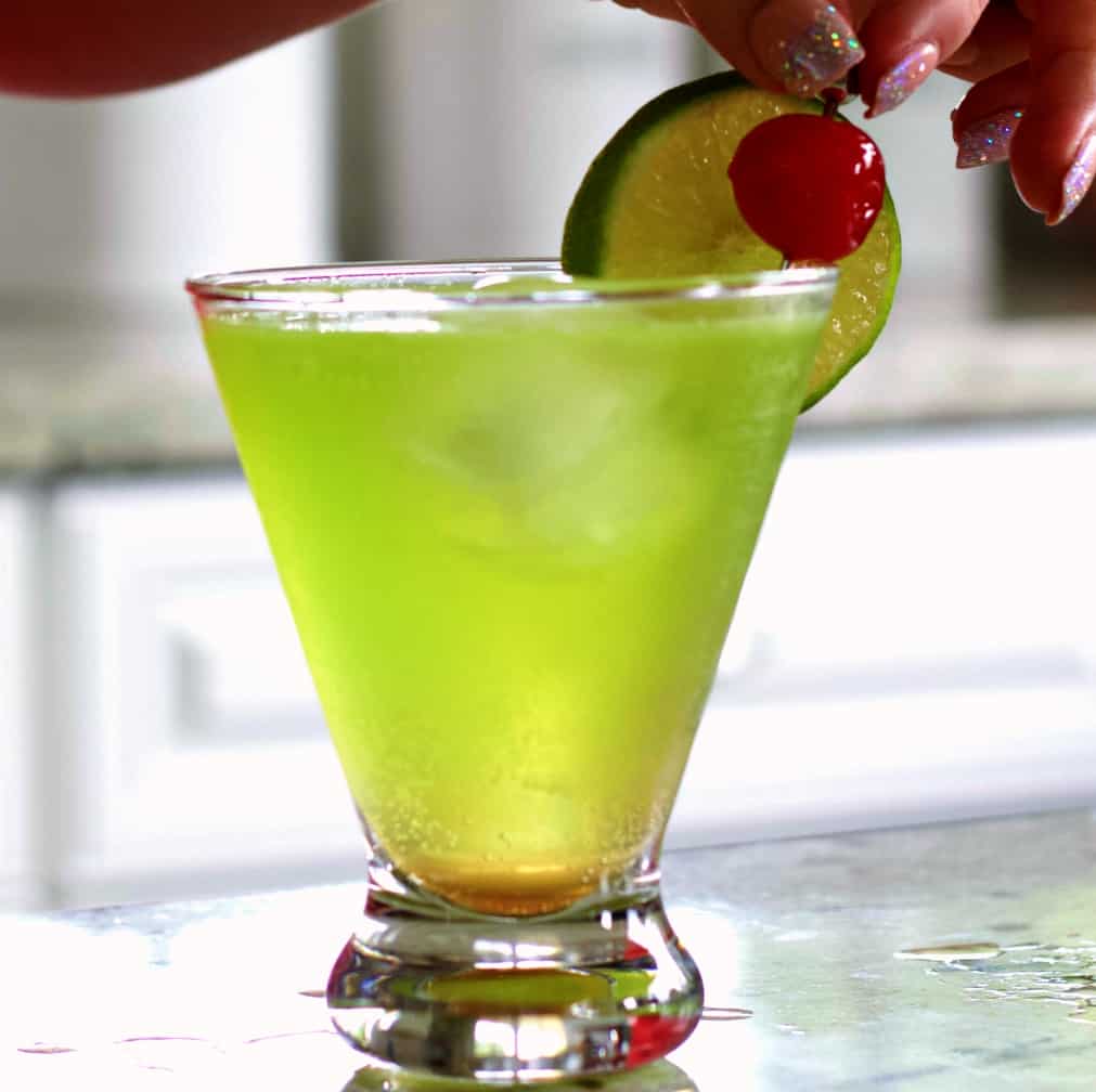 garnishing with cherry and lime wheel