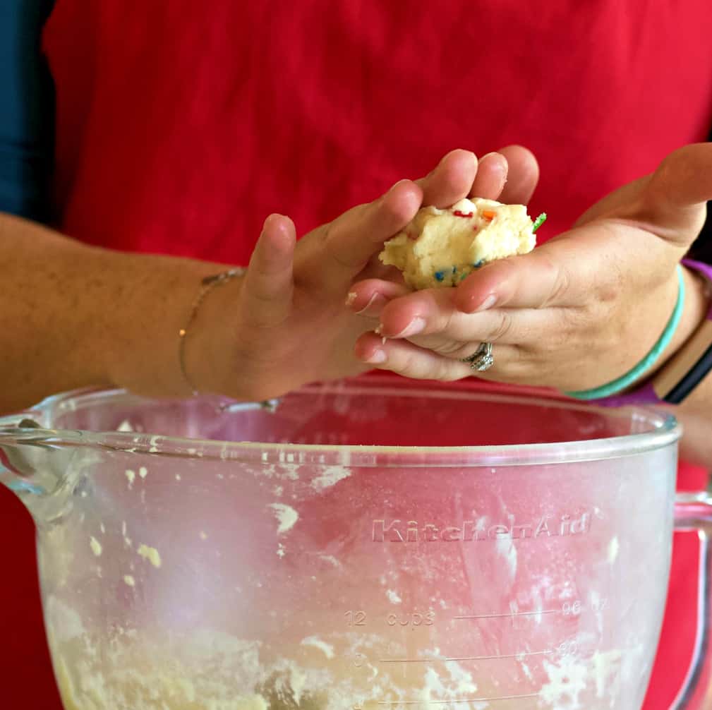 rolling a cookie dough ball