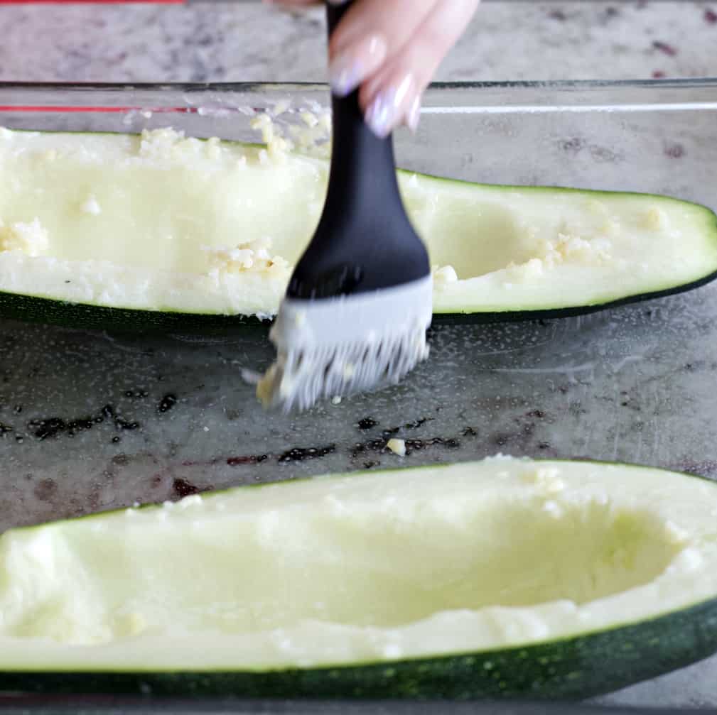 brushing on oil and garlic