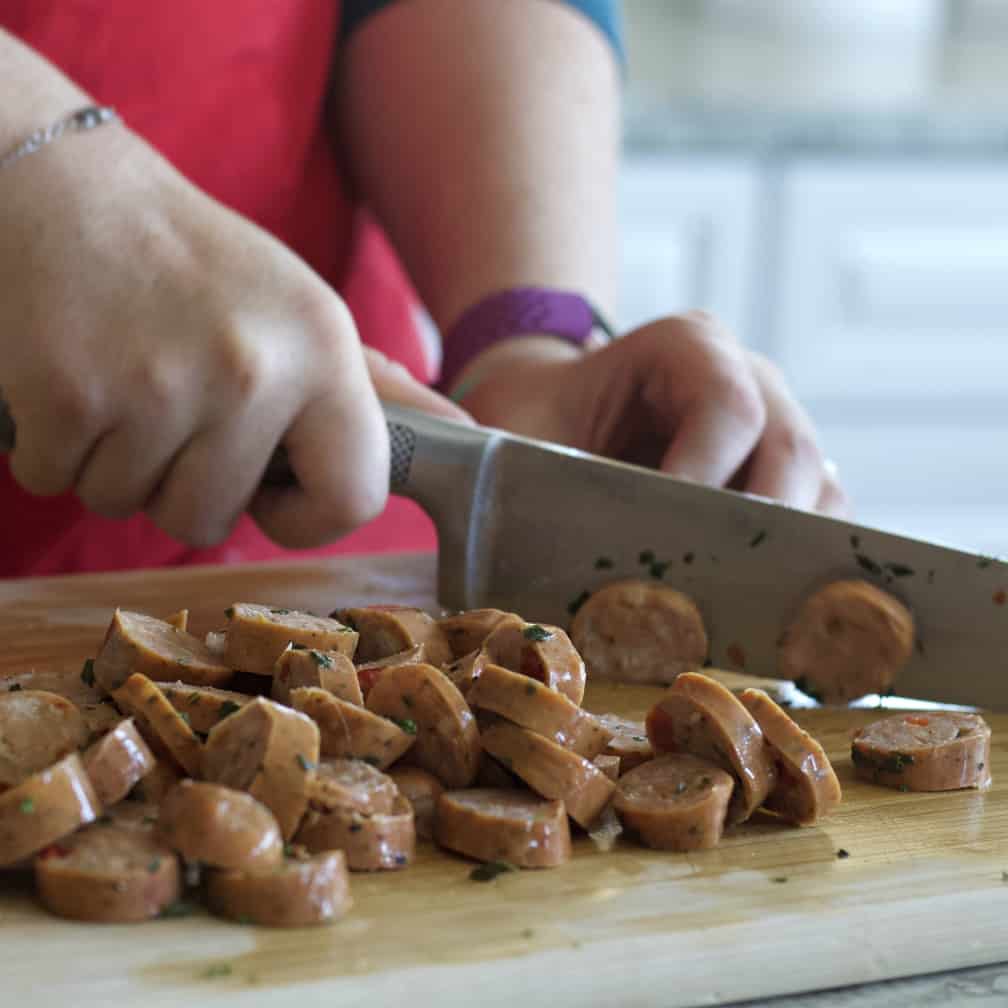 Instant Pot Lentil Soup Recipe 9 slicing chicken sausage