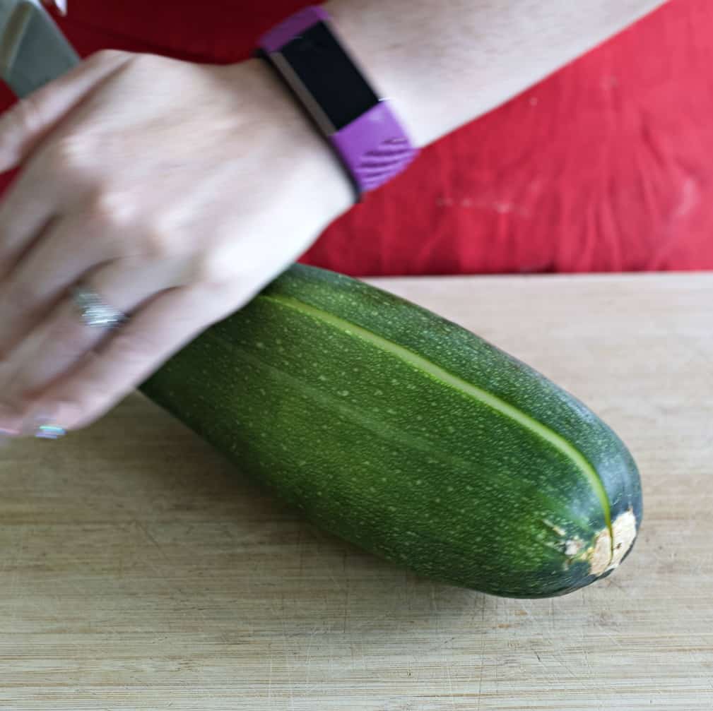 slicing zucchini in half