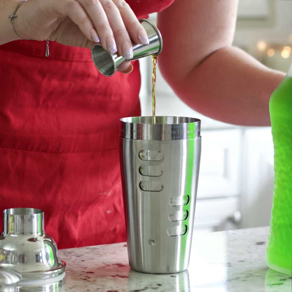 pouring Midori for Midori sour