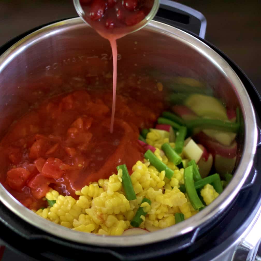 adding beans to vegetable soup