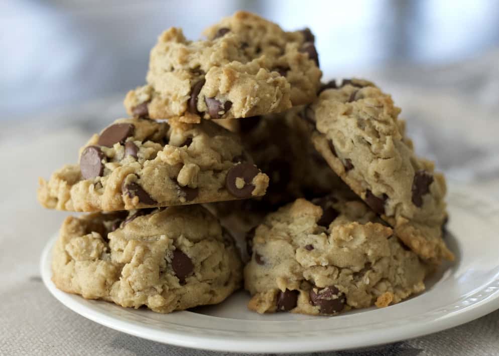 peanut butter cookies with oatmeal and chocolate mounded together on a plate