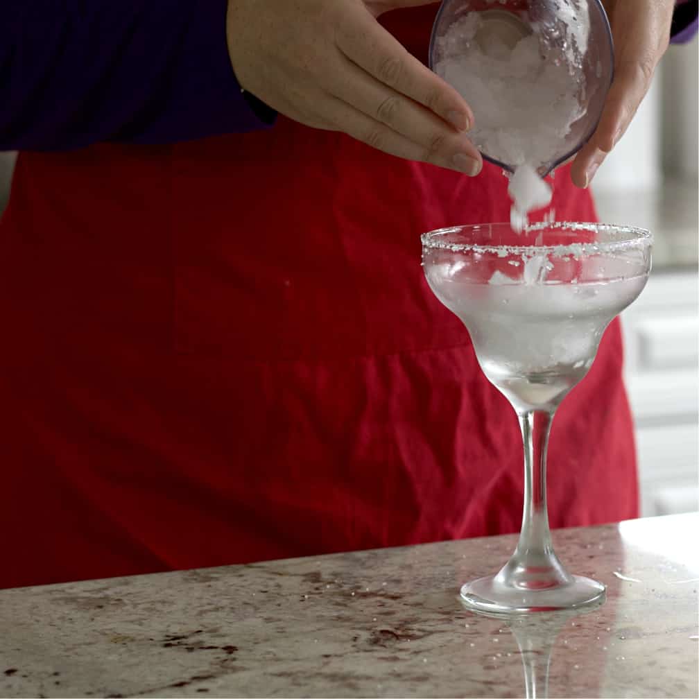 Cadillac Margarita Recipe with Grand Marnier 13 adding ice into margarita glass