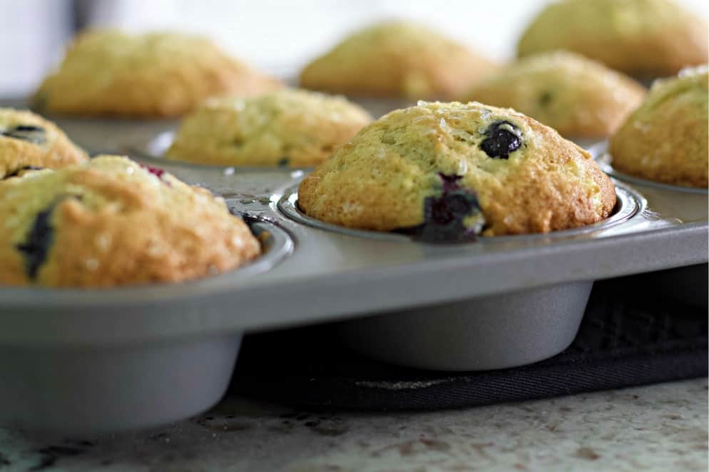banana blueberry muffin in tin