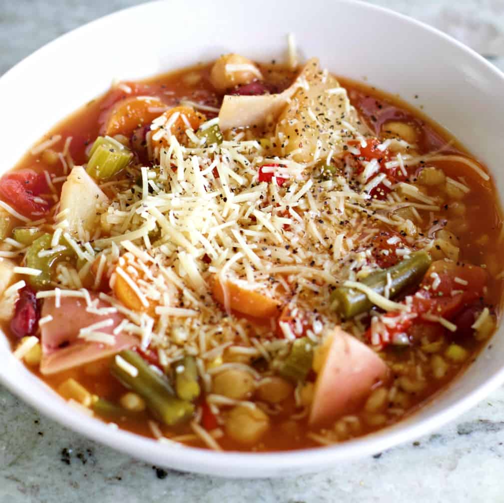 vegetable soup with cheese on top