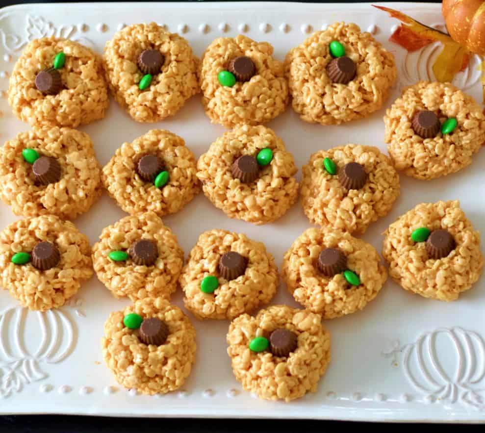 pumpkin rice krispie treats on white platter