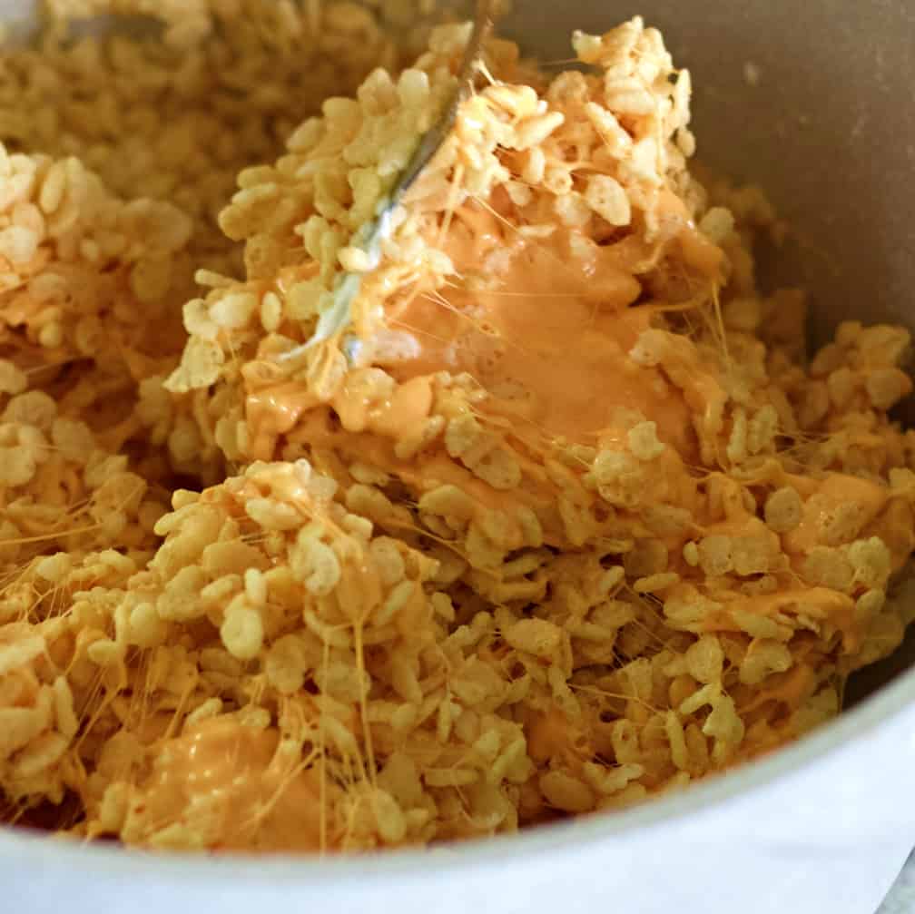 stirring pumpkin rice krispie treats