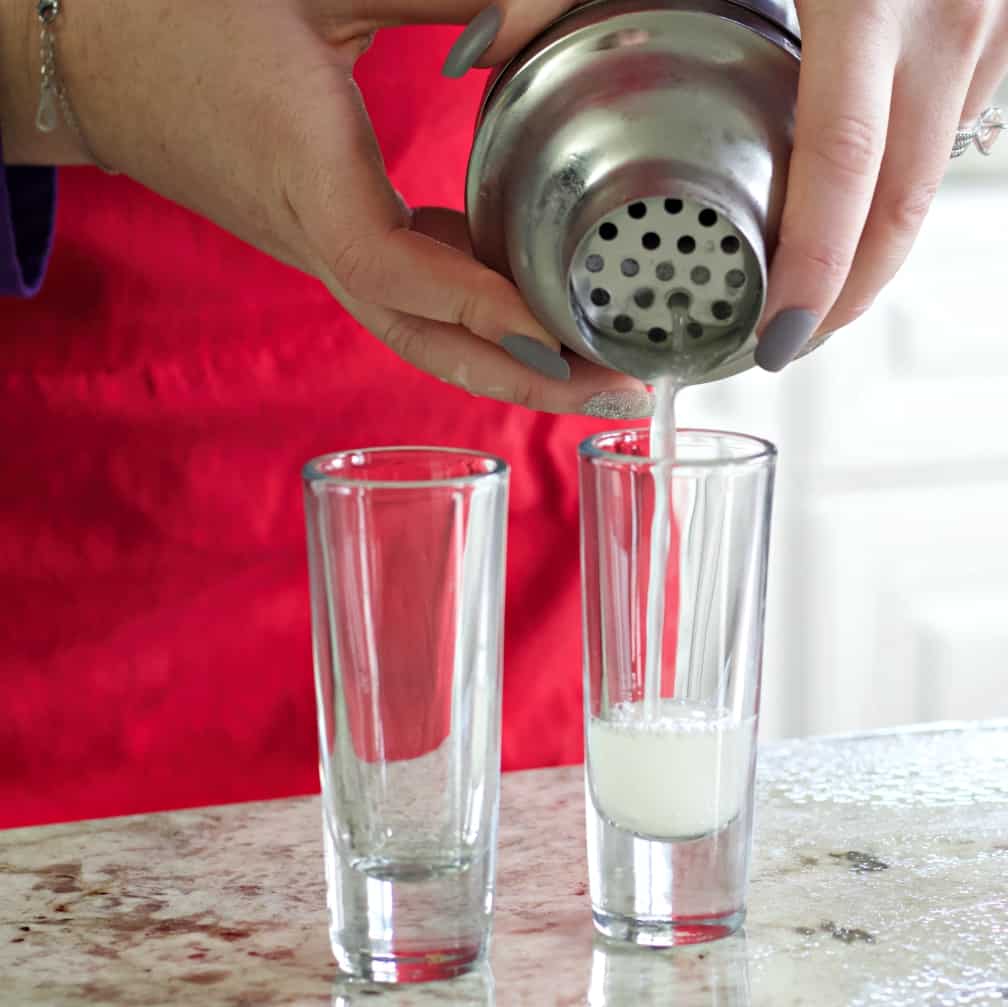 pouring a pineapple shot