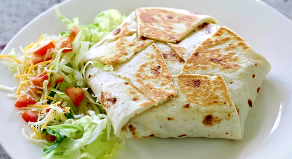 crunchwrap supreme on white plate