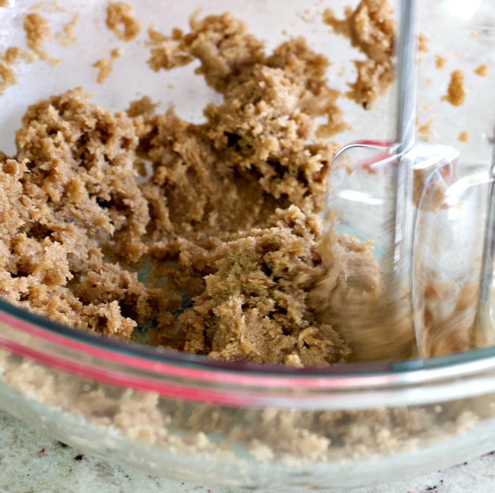 mixing brown sugar and coconut oil
