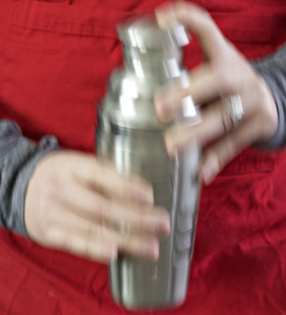 shaking a cocktail vertically