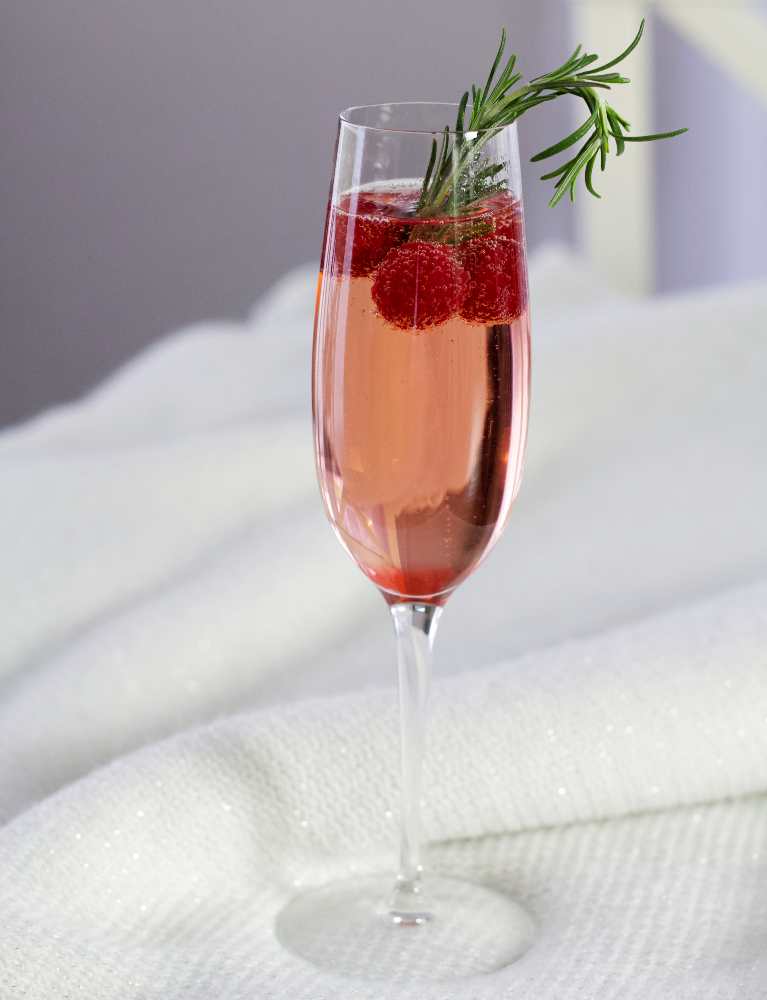 champagne cocktail on white throw
