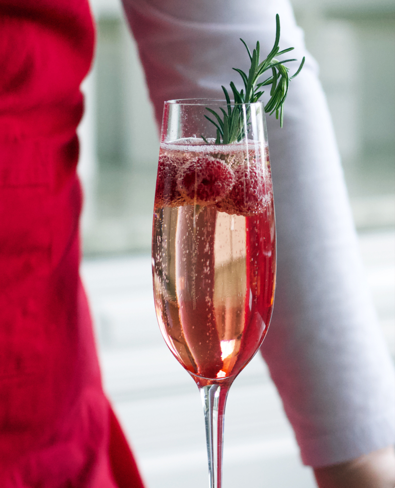 garnishing champagne cocktail