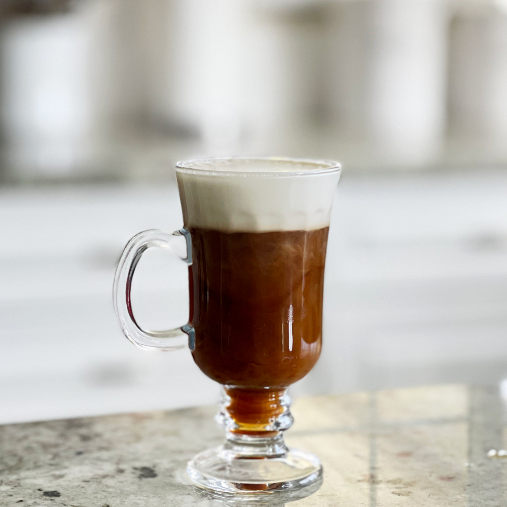 Irish coffee in a mug with whipped cream