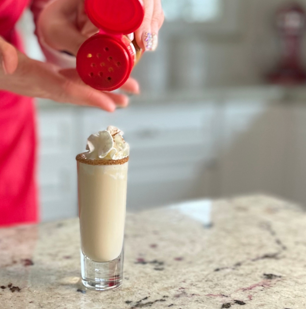 sprinkling cinnamon on a shot