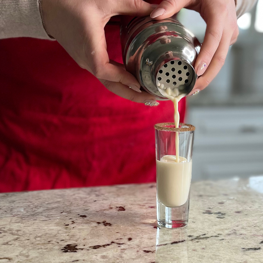 straining a cinnamon toast crunch shot