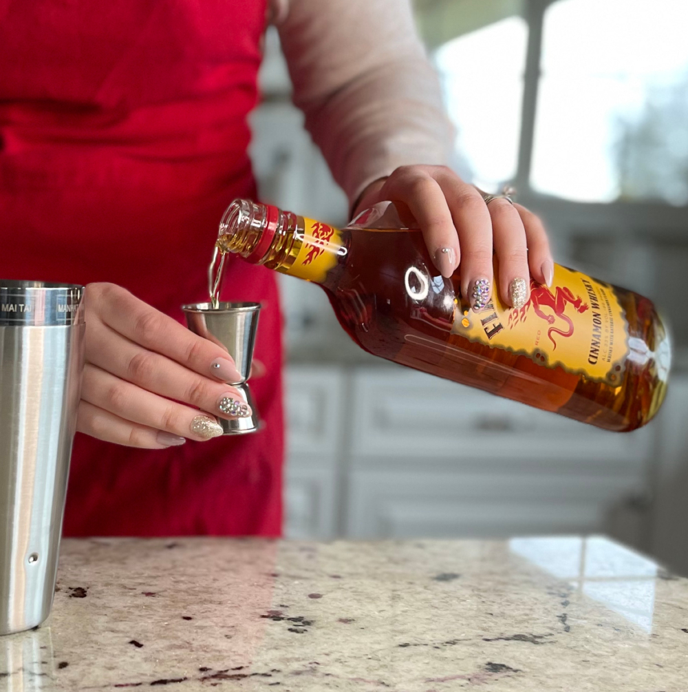 Cinnamon Toast Crunch Shot Recipe 14 measuring fireball whiskey