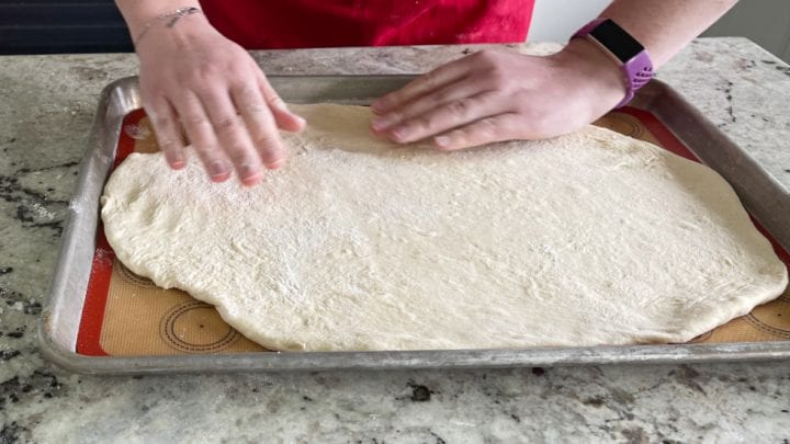 forming flatbread in a pan