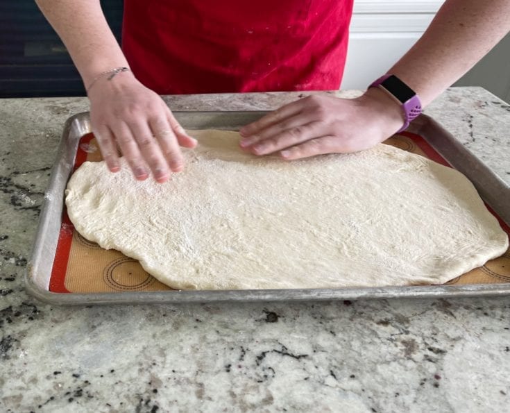 forming a pizza from flatbread