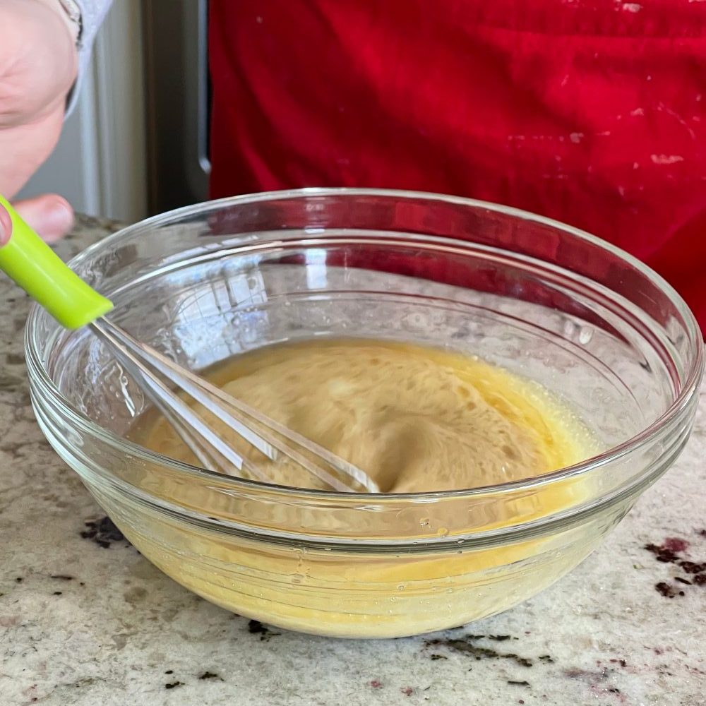 whisking Greek salad dressing