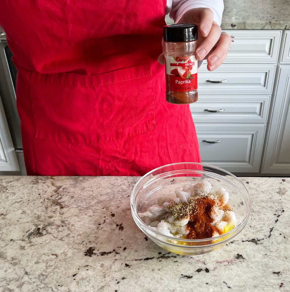 Mediterranean Shrimp Sheet Pan Dinner 16 adding smoked paprika to shrimp