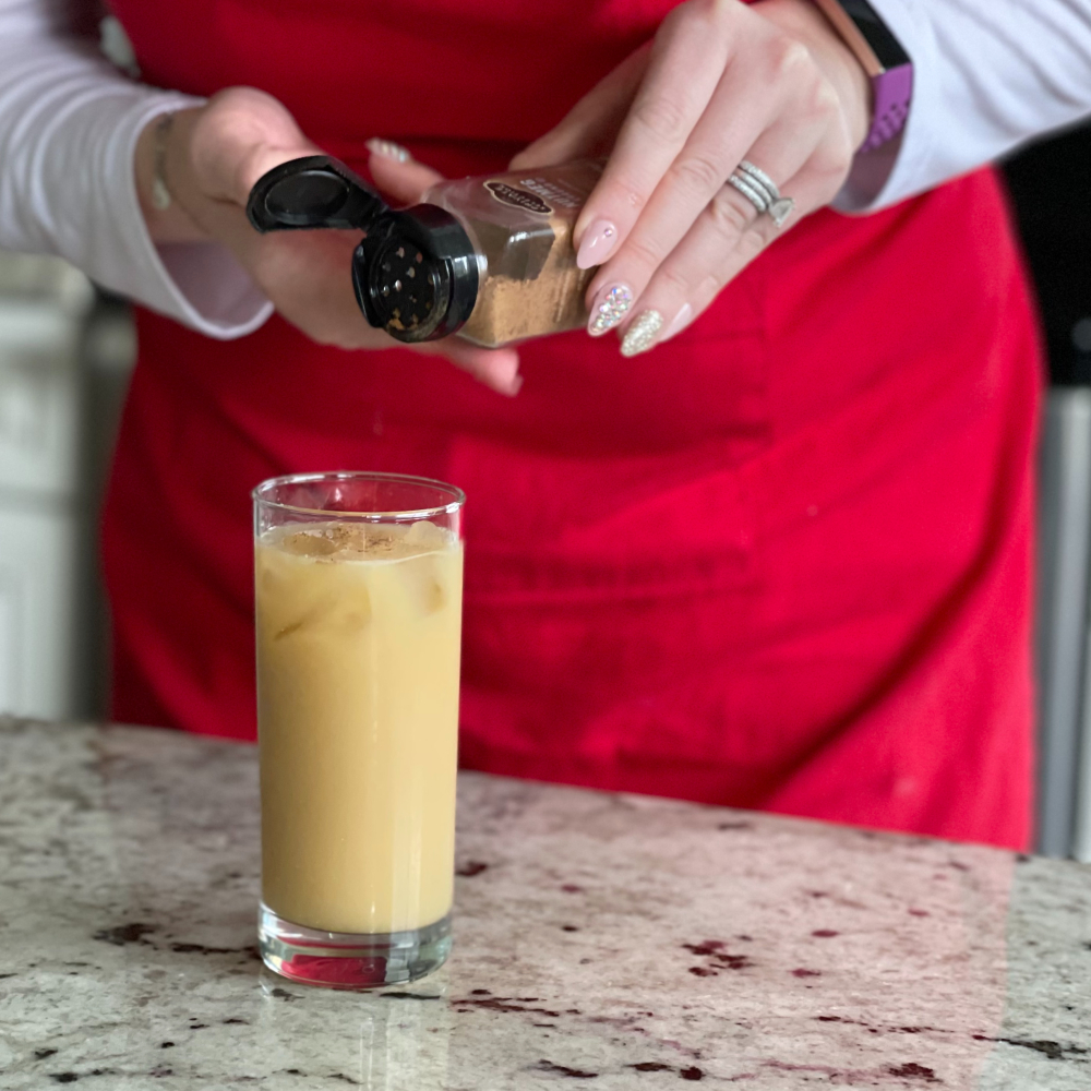 sprinkling nutmeg over painkiller