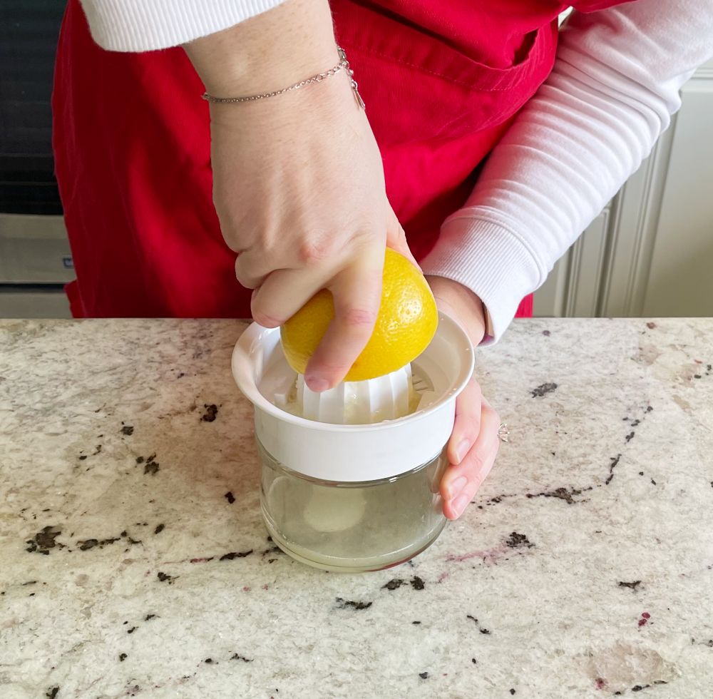 Mediterranean Shrimp Sheet Pan Dinner 13 squeezing fresh lemon